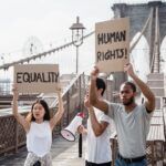 people holding protest posters