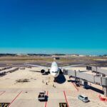 passenger airplane parked at a airport terminal